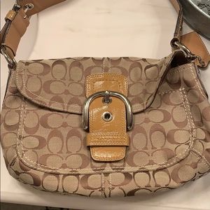 Coach purse with thick strap and multiple pockets
